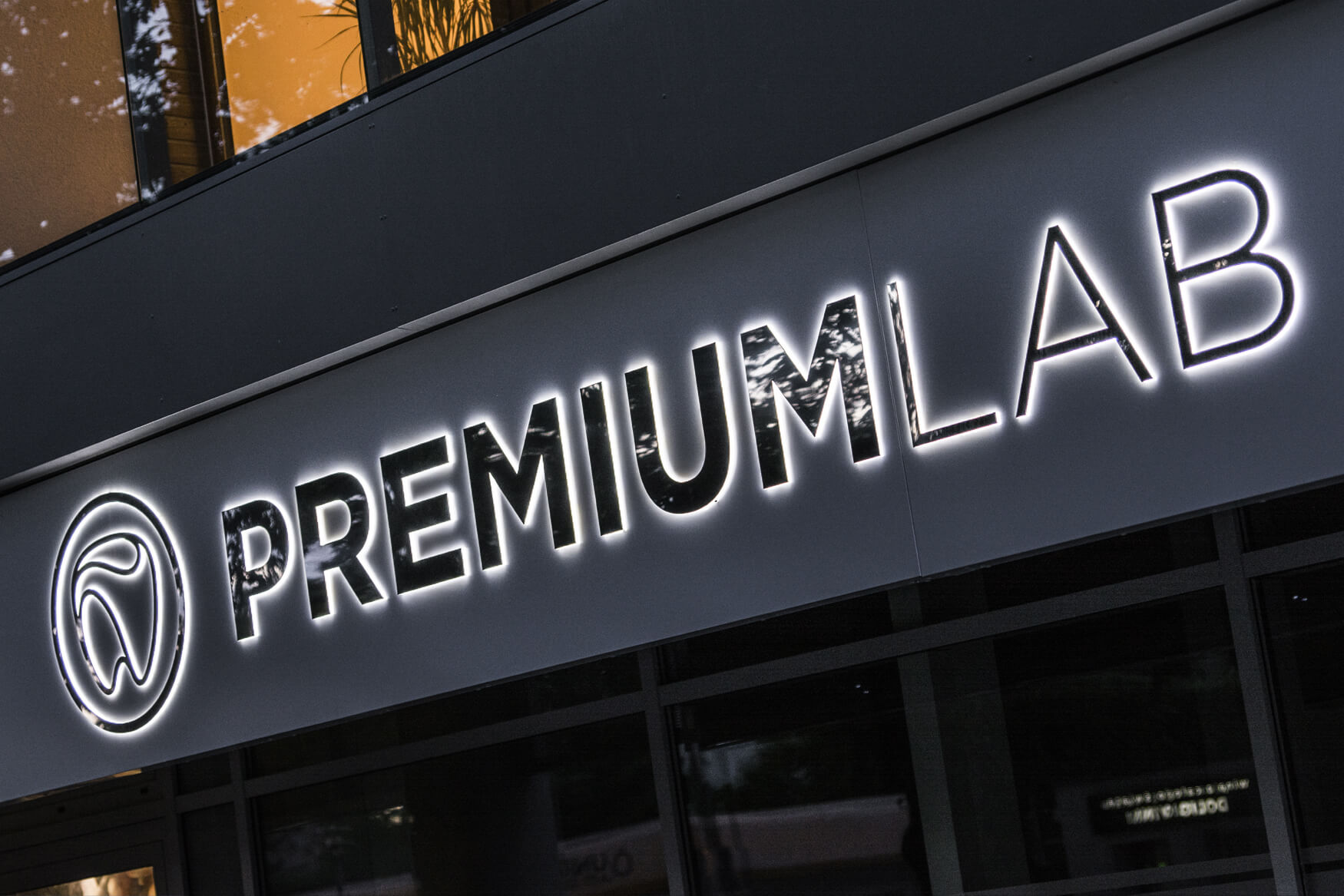 Premiumlab - a company sign placed on an advertising coffer with spatial letters made of sheet metal