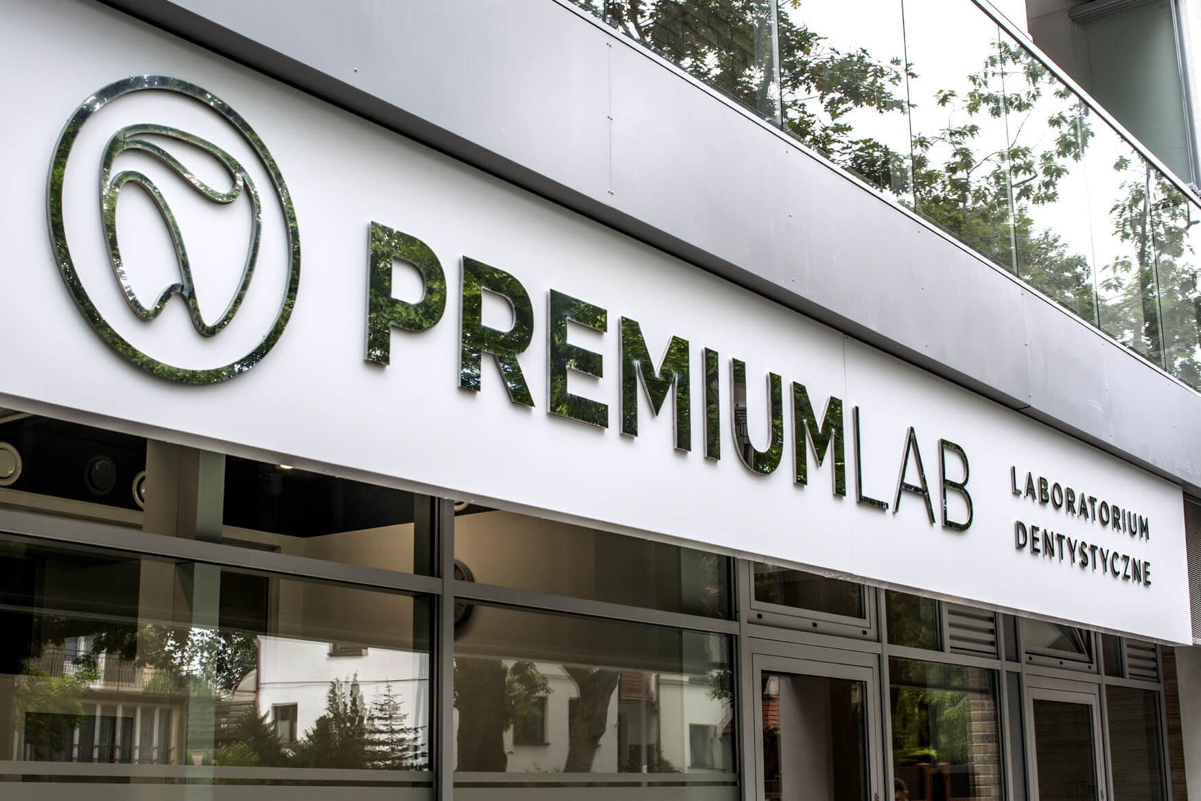 Premiumlab - a company sign placed on an advertising coffer with spatial letters made of sheet metal