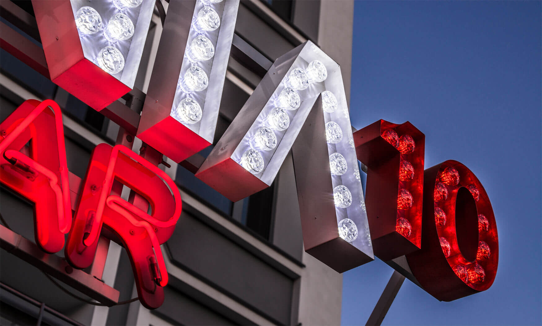 Closet 10 - letters with light bulbs placed on a frame above the entrance