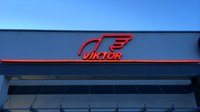 Viktor - logo and LED light space letters placed above the entrance