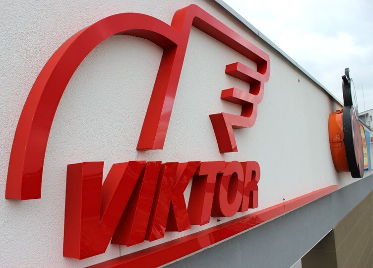 Viktor - logo and LED light space letters placed above the entrance