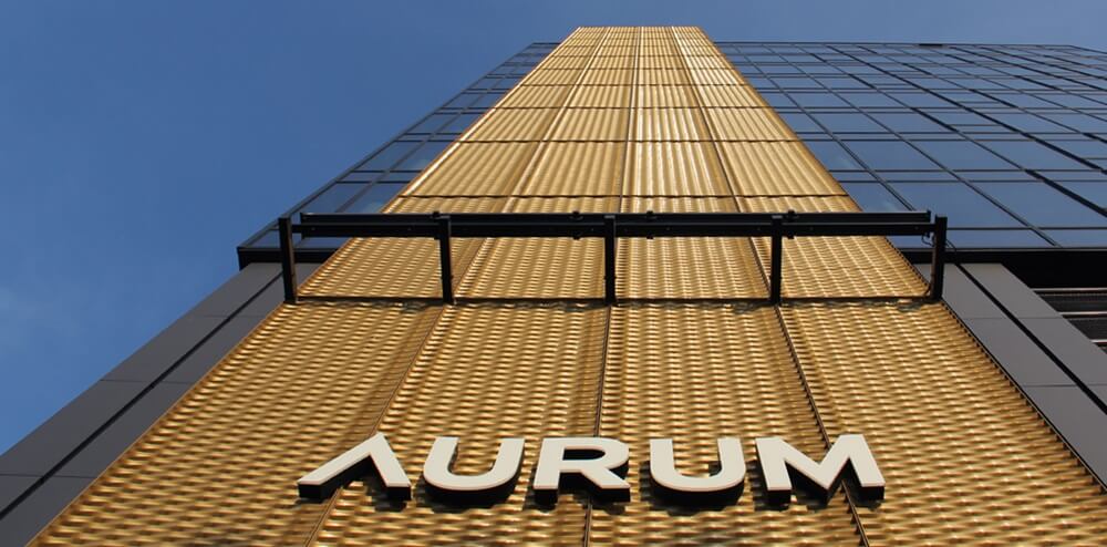 Aurum - spatial LED light letters over the entrance on a frame