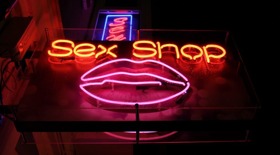 Sex Shop - outdoor neon sign placed above the entrance