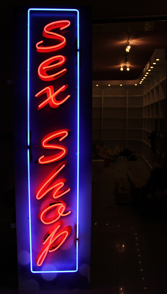 Sex Shop - outdoor neon sign placed above the entrance