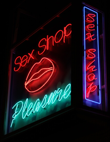 Sex Shop - outdoor neon sign placed above the entrance