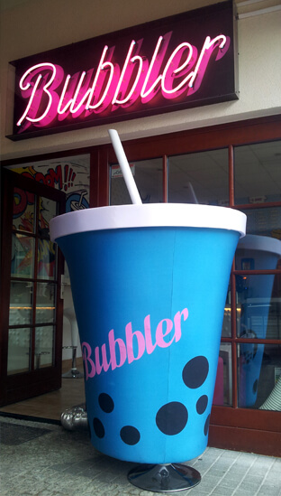 Bubbler - outdoor neon sign, placed above the entrance