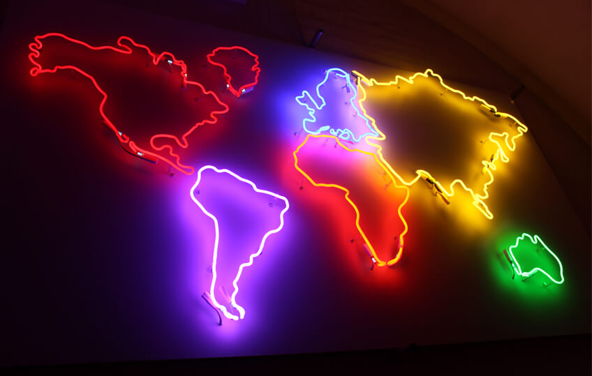 Map of the world created as a neon sign, placed on the wall inside the premises