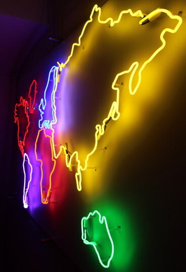 Map of the world created as a neon sign, placed on the wall inside the premises