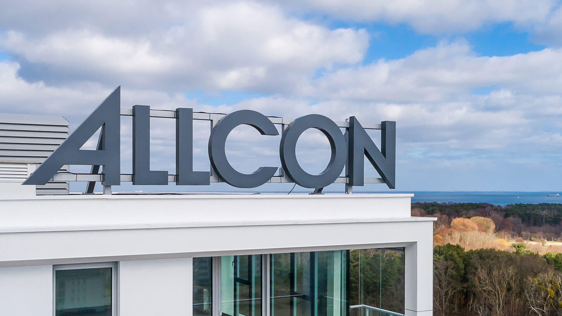 allcon-literal-large format - allcon-lit lettering - large-format-3d-from-plexi-lights-on-top-of-a-building