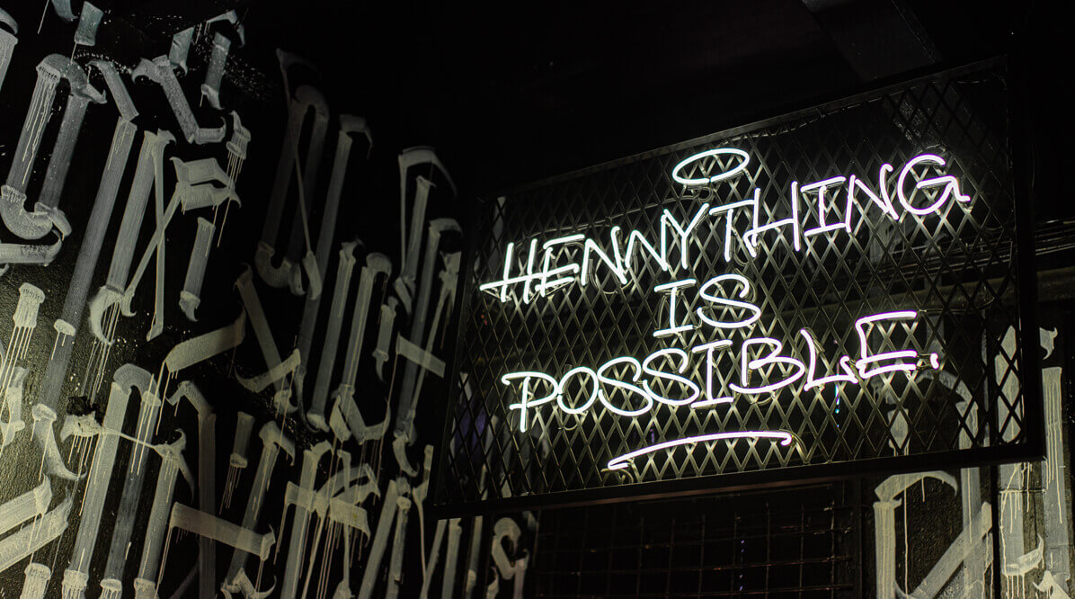 Hennything is possible - Neon sign advertising above the bar in Gdańsk.
