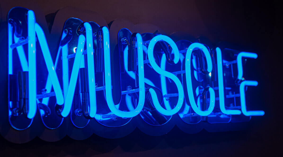 Hustle for that muscle - blue neon on the wall