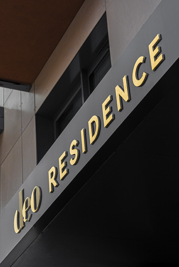DEO Residence & SPA coffer - A panel with golden letters above the entrance to DEO Residence & SPA