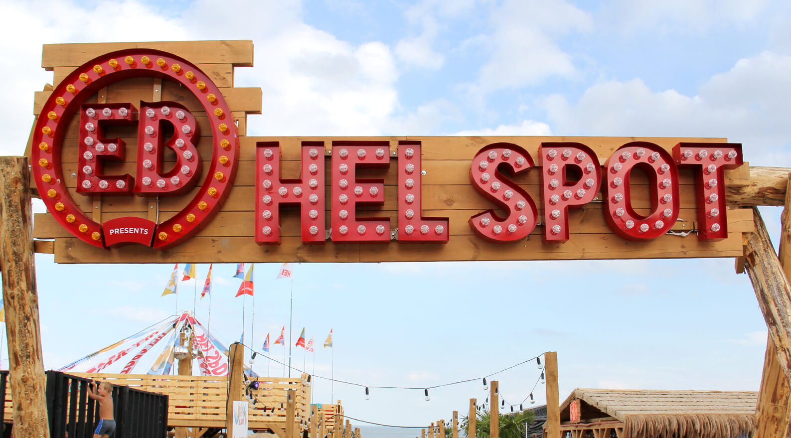 EB hell spot - EB Hel Spot Festival - logo and letters with bulbs placed on a wooden frame above the entrance