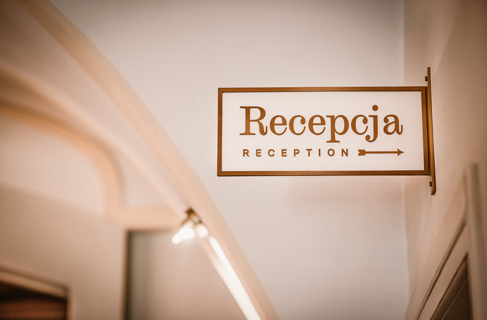 Reception signage - semaphore pointing to the reception area in the lobby