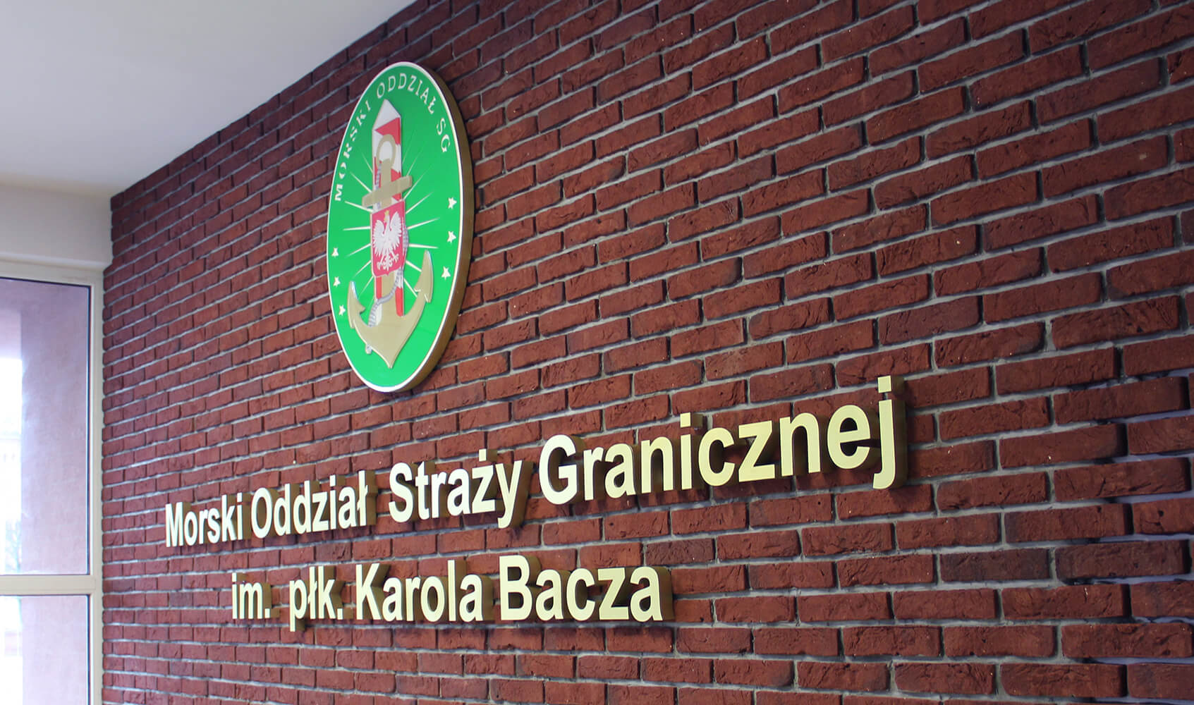 MaritimeBranch Guard Graniczna - Morski Oddział Straży Granicznej (Border Guard Sea Branch) - building signage, logo and styrodur letters placed on the brick wall