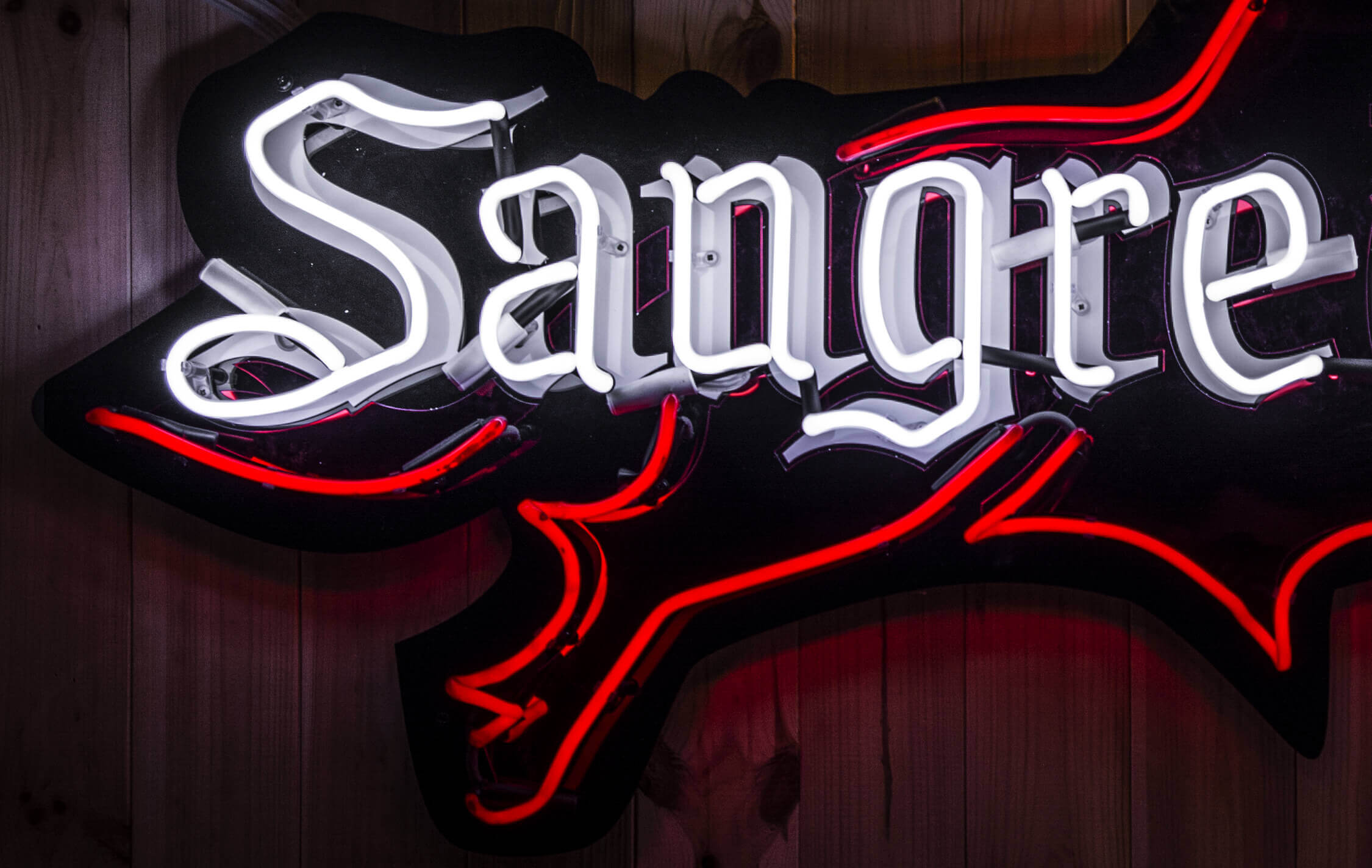 Sangre De Toro - neon-on-order-sangre-the-torro-neon-on-a-bar-with-neon-plexi-red-mirror-glass-tinted-in-mass-red-neon-on-electrical-desks