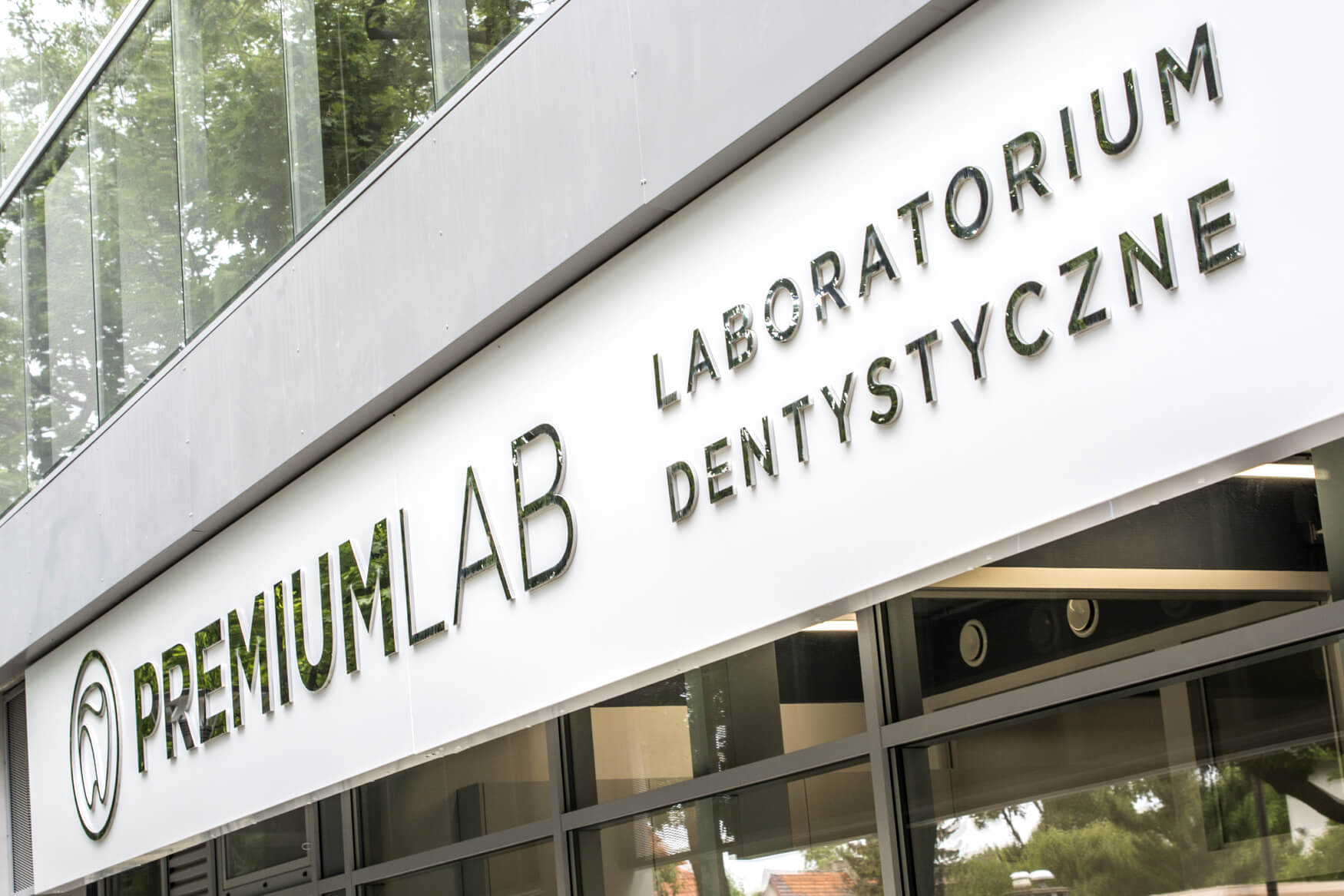 Premiumlab - Premiumlab - company sign placed on an advertising panel with metal spatial letters