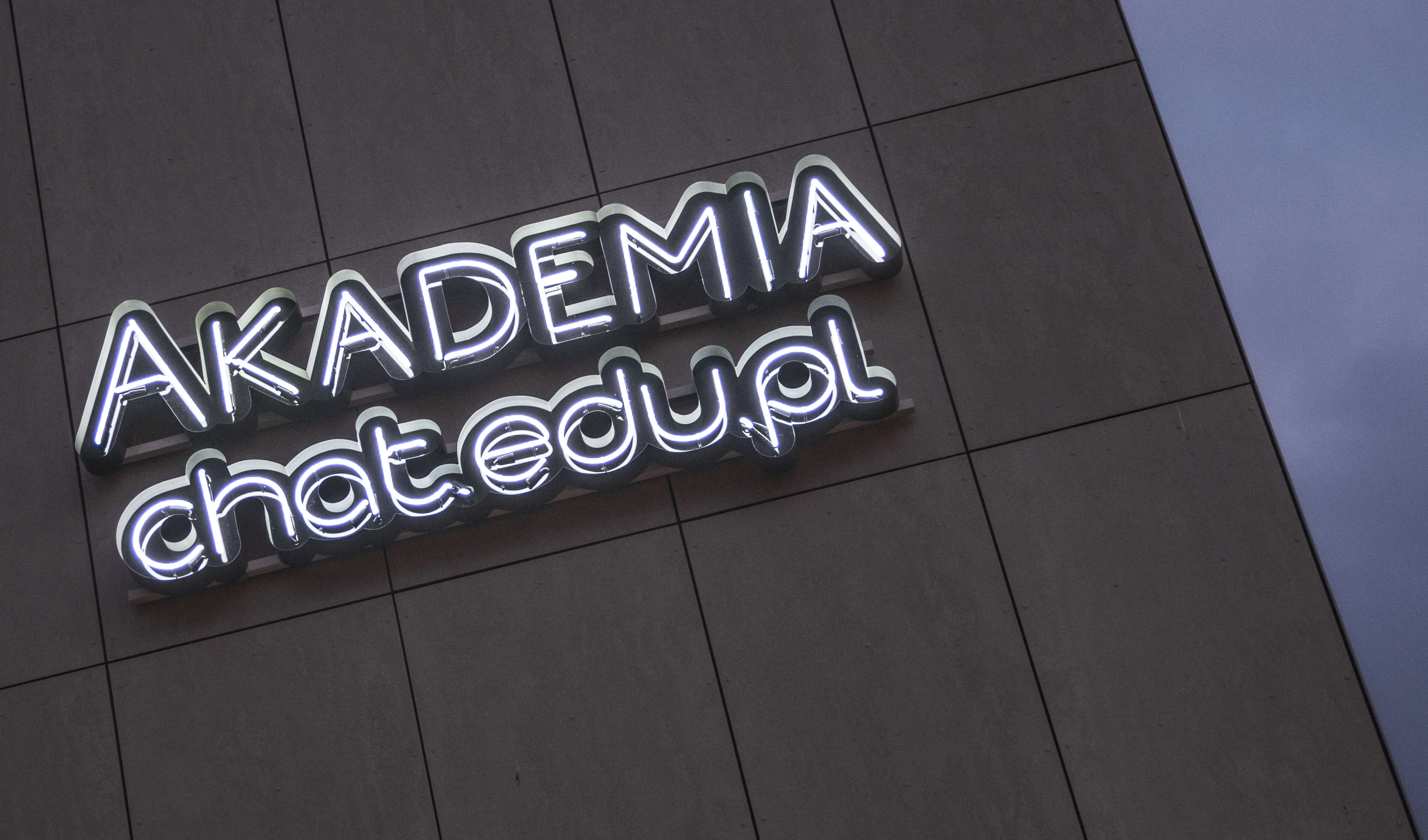 Academy Chat edu - neon-academy-chat-edu-warsaw-neon-producer-neon-on-the-building-front elevation-neon-at-height-luminescent-neon-order-neon-on-the-exterior-of-the-building-logo-neon letters-neon-university