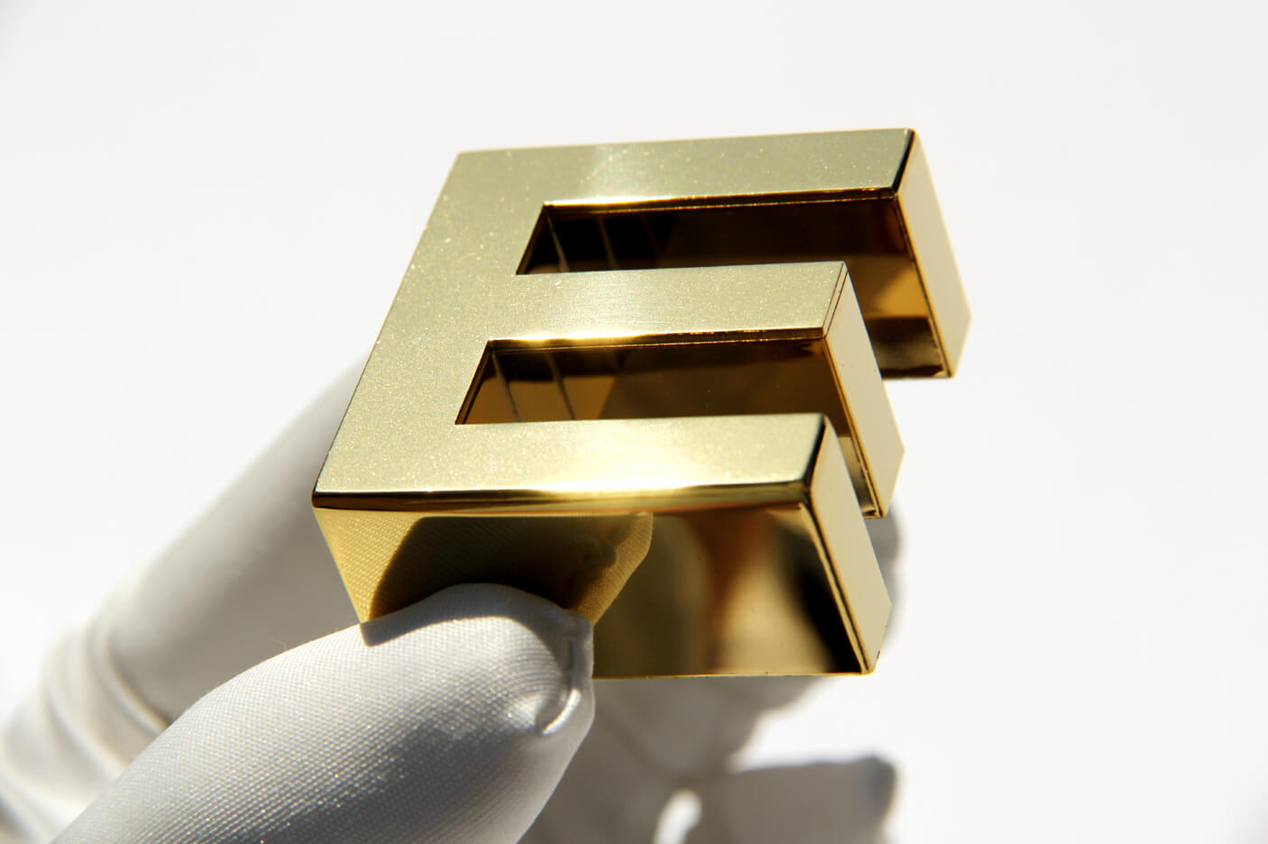 Letter E - made of stainless steel, polished in gold color
